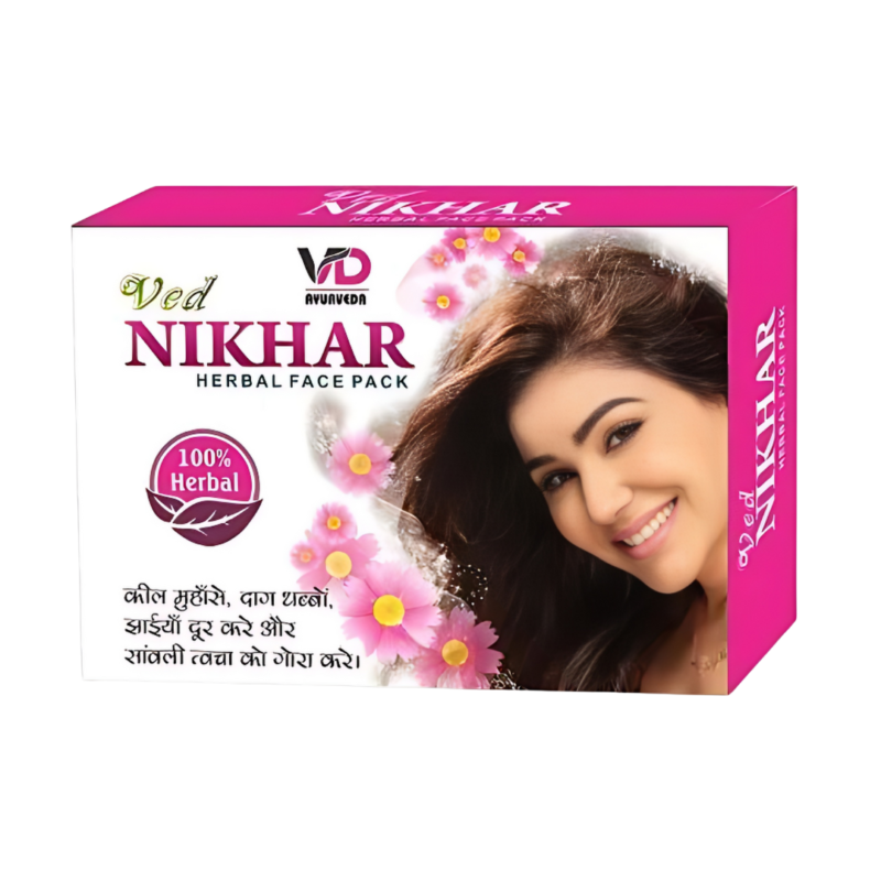 A box of Ved Nikhar herbal face pack with a pink and white pigment tone laid horizontally is a fully safe ayurvedic remedy for treating acne that is both therapeutic and preventive.